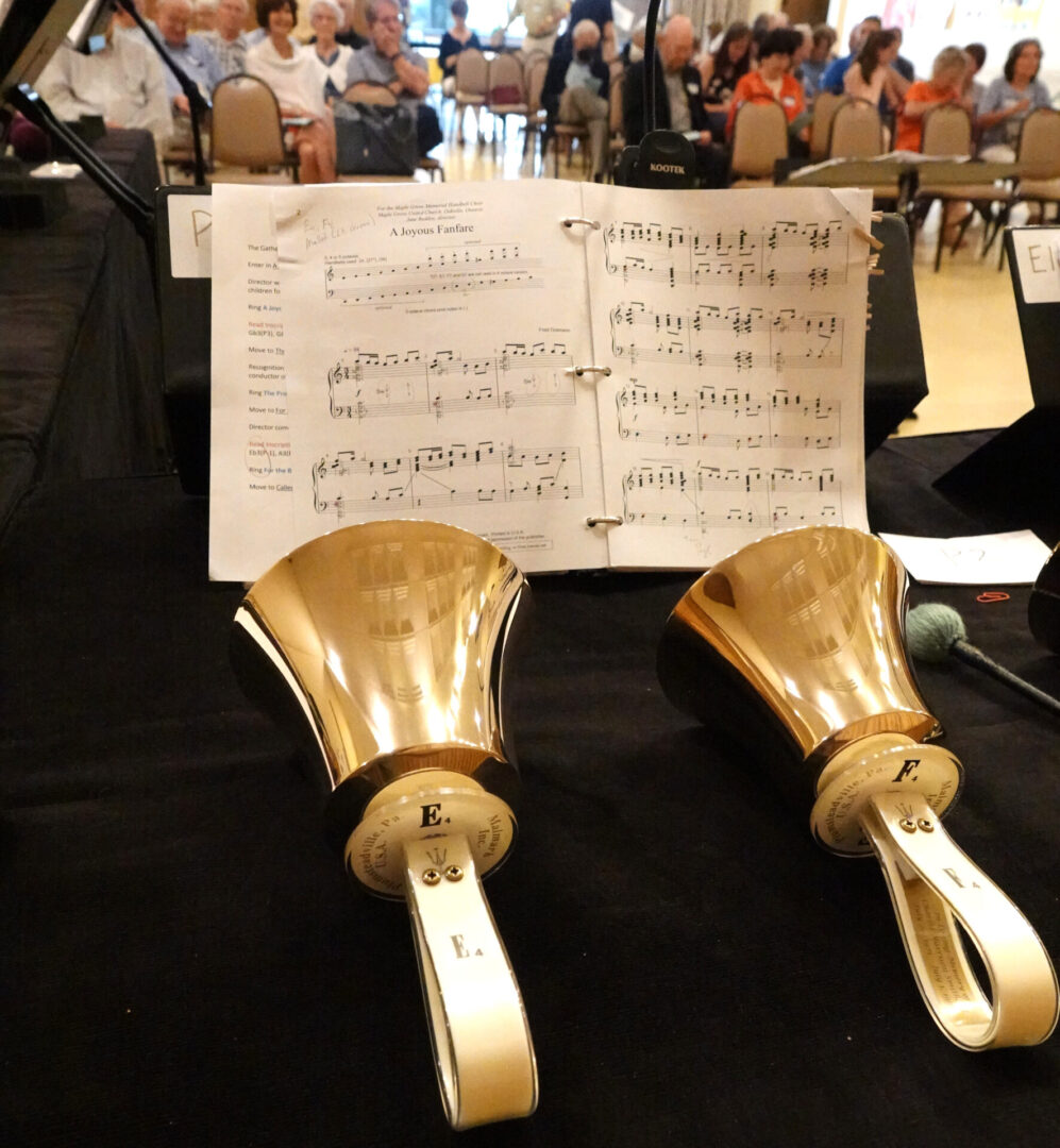 Two handbells with music